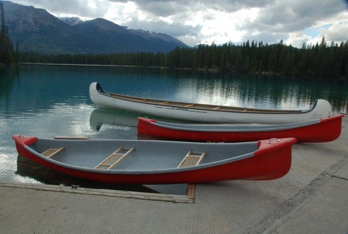 canoe boats on lakeshore